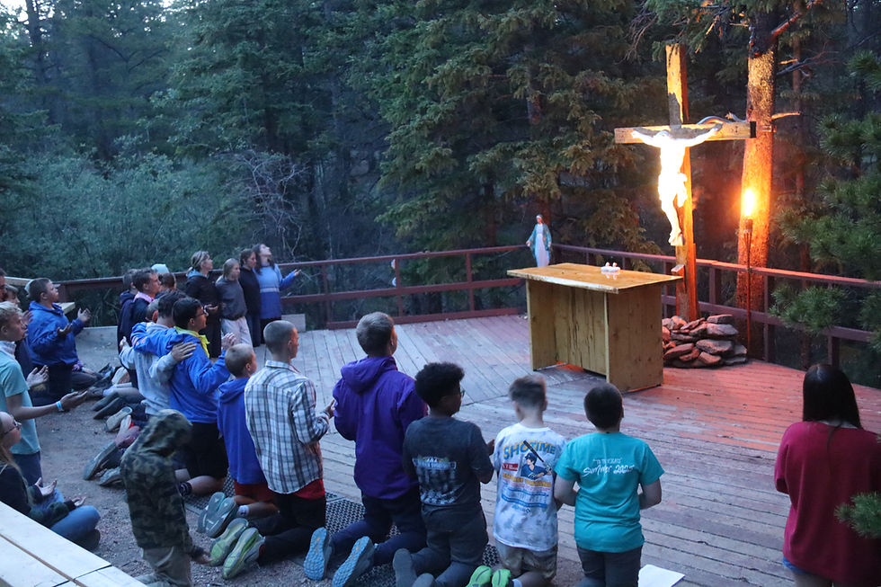Youth Summer campers praying together at Annunciation Heights. AH Media Staff